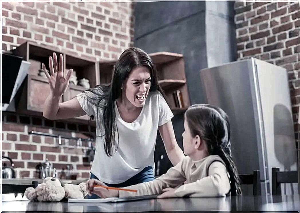 Mother raising her hand to her daughter.