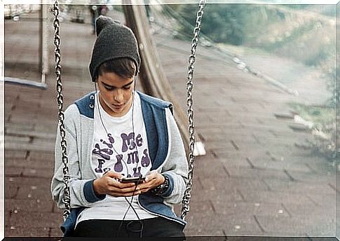 boy on cell phone, it's important to ban smartphones for children