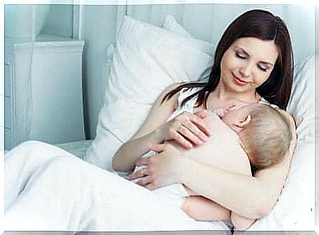 Lactation and amenorrhea method: mother looking at baby to breastfeed