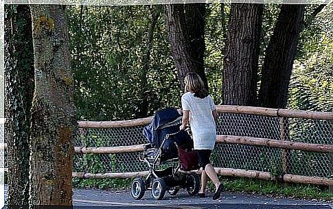 mother walking with baby