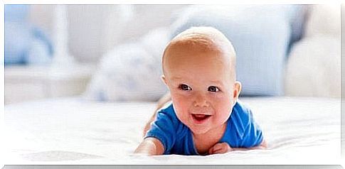 baby crawling on the bed